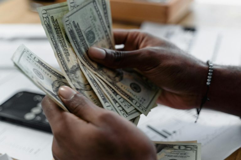 A person counting cash.
